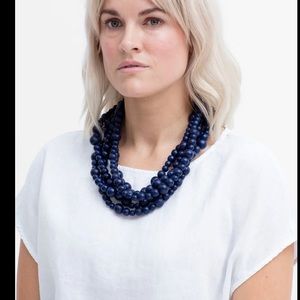 Multi strand wood navy necklace by Elk the Label. Handmade by artisans.